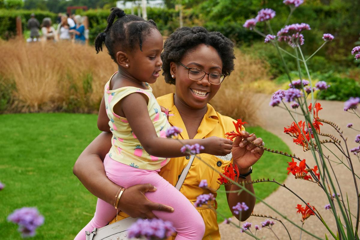 Lady and child looking at flowers