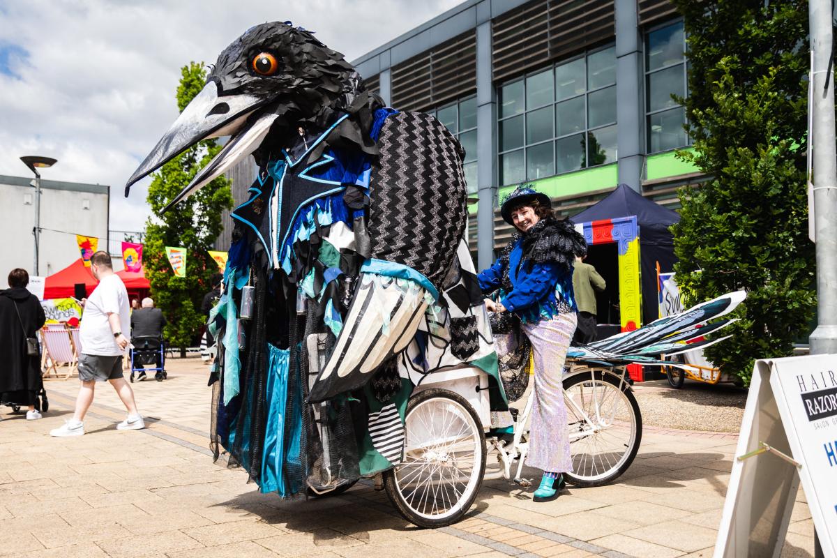 Theatrical bike with giant crow at the front 